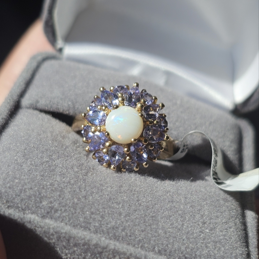 New. 10k Australian opal & tanzanite ring size 7. Stamped 10k. New with tags. Gr